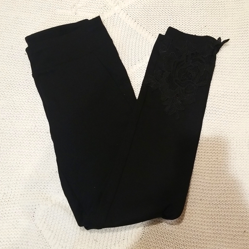 Black leggings with floral trim
